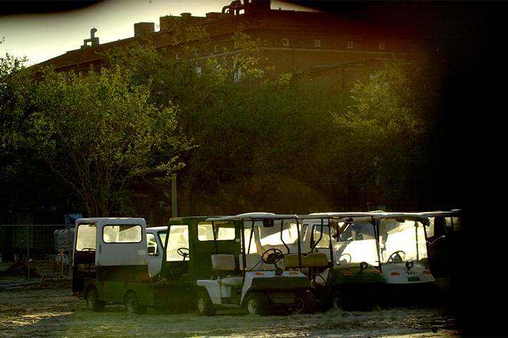 Flooded golf carts once used by facilities services employees sit idle along Newcomb Boulevard. 