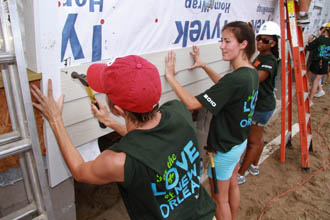 students building a home