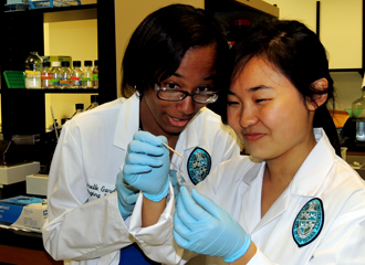 Emerging scholars Lirelle Gardere, left, and Xiaoshu Zheng