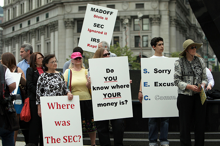 People protesting against Bernard Madoff People protesting against Bernard Madoff