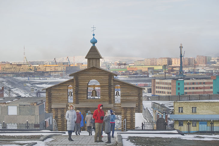 The entrance to the “Golgotha” memorial overlooks the city of Norilsk, Russia. The entrance to the “Golgotha” memorial overlooks the city of Norilsk, Russia.