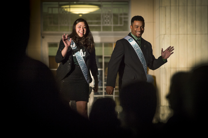 Homecoming court members are introduced including seniors Sue-Claire Lichtveld and Richard Carthon, a safety on the Green Wave football team.