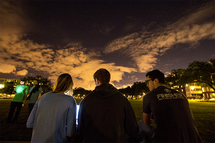Homecoming festivities begin with the Lighting of McAlister. Following the ceremony, sophomores Hannah Case, Parker Bradley and Shea McGrinder relax on the Lavin-Bernick Center quad.
