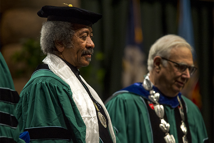 Musical legend Allen Tousaint (left) waits to an honorary degree from Tulane University president Scott Cowen during the 2013 Commencement ceremony. Tousaint died of a heart attack in the early morning on Tuesday (Nov. 10) following a performance in Madrid, Spain. 