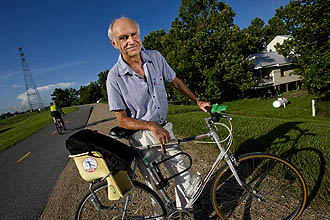 Oliver Houck w/bike on levee
