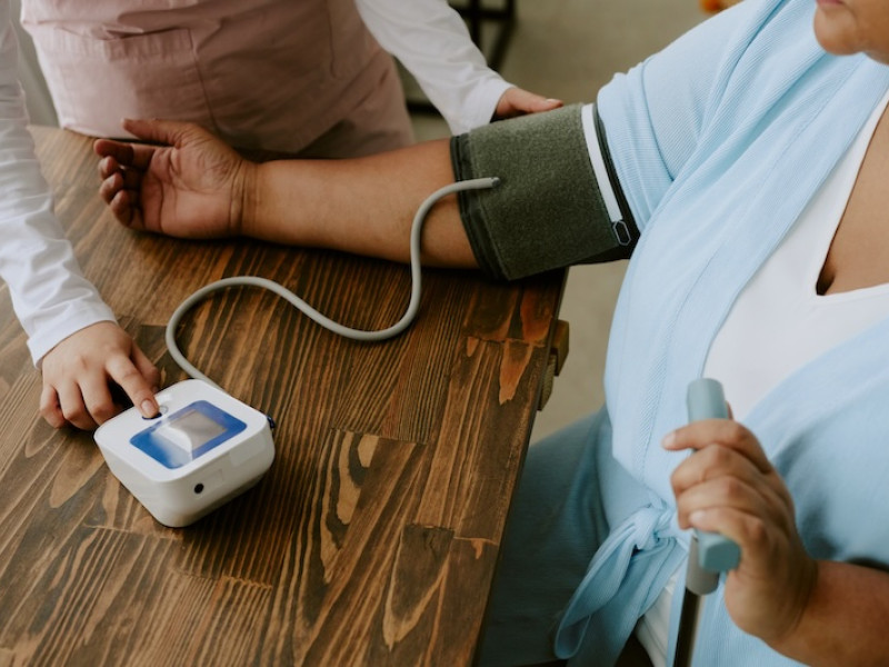 A woman's blood pressure is checked 