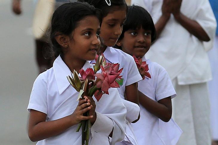 Sri Lankan tsunami survivor children attend a Buddhist religious ritual procession