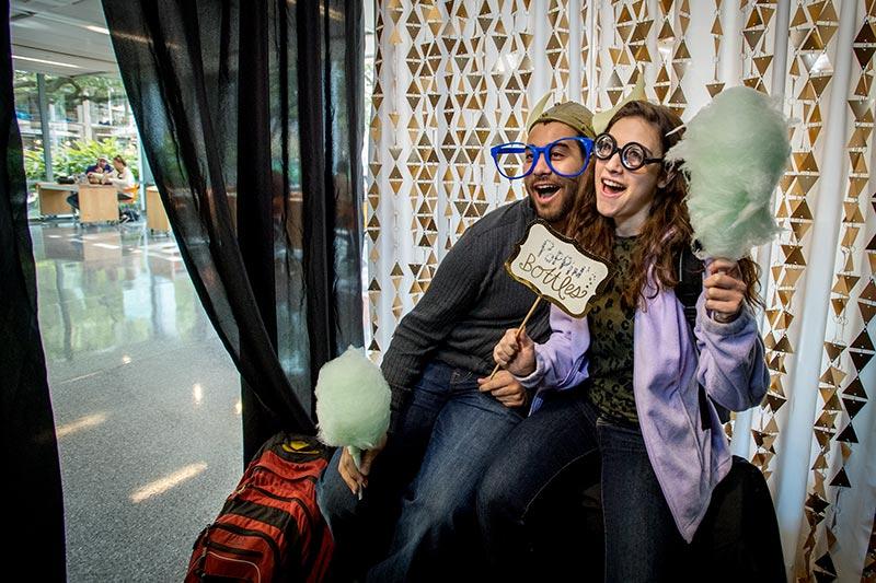 Tulane juniors Tyler Diaz, left, and Elena Garidis share a laugh in the photo booth. The Lavin-Bernick Center hosts a sweet celebration.