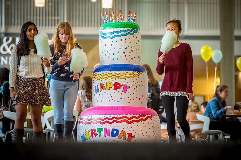 First-year students, from left, Aastha Gupta, Antonia Asher, and Stephanie Zhao head back to class, cotton candy in hand. The Lavin-Bernick Center hosts a sweet celebration.