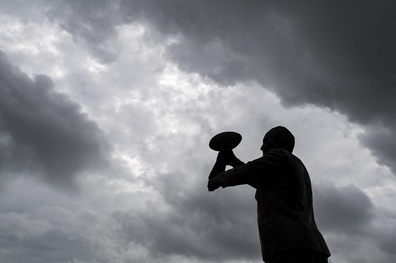 Tom Benson’s likeness raises the Lombardy Trophy towards the sky. The statue, by sculptor Brian P. Hanlon, was dedicated in 2014. Benson, a native son and owner of the Saints and the New Orleans Pelicans, died on Thursday afternoon due to complications from the flu.
