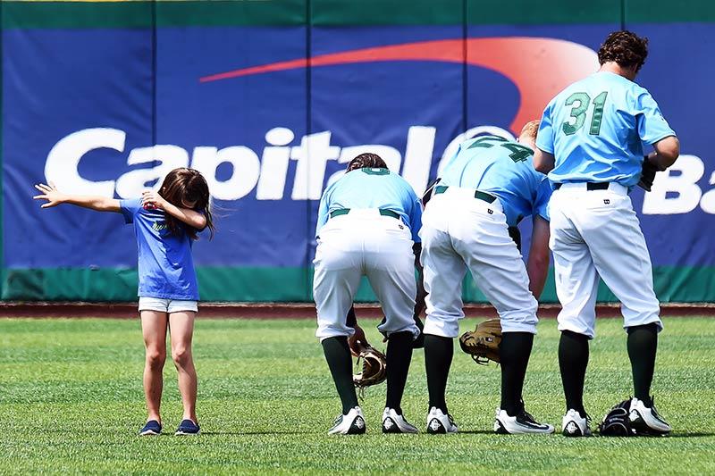 A young Tulane fan does the dab following the national anthem before the Green Wave’s game against Stetson University on Sunday. 