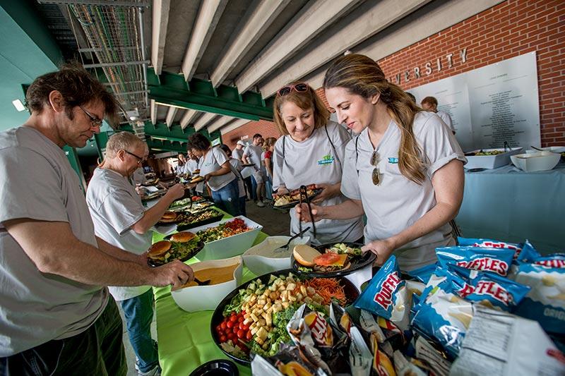 More than 600 Tulane staffers from the New Orleans, North Shore and Mississippi campuses volunteered to spread out across the region and help local non-profits for the Wave of Green Day of Service.