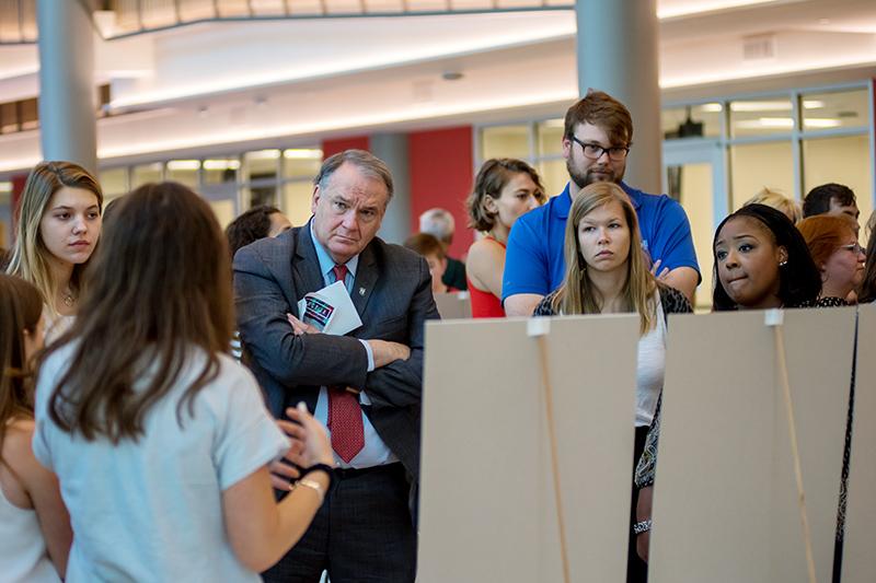 Tulane president Mike Fitts, center, listens as students present their ideas. Students share ideas for confronting sexual misconduct in the Tulane community.