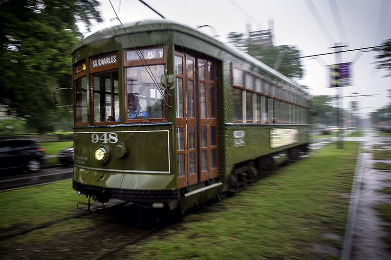 A street car cuts through rain showers on the St. Charles Avenue line directly in front of Tulane’s uptown campus. 