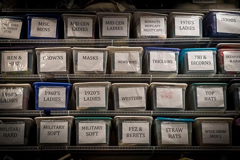 To top it off, designers have a huge selection of hats from which to choose. A close-up view of the costume shop reveals the importance of organization.