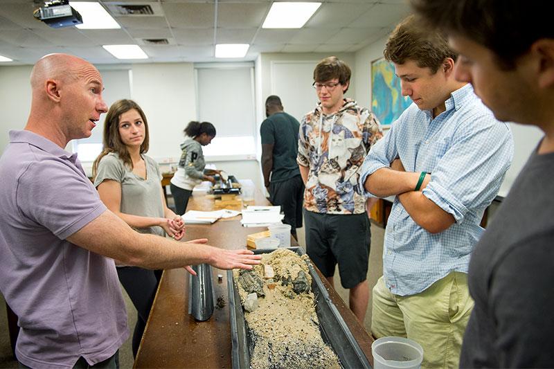 Students in Physical Geology Lab explore how water creates various landforms, like stream channels and deltas, through erosion, transport, and deposition of sediment.