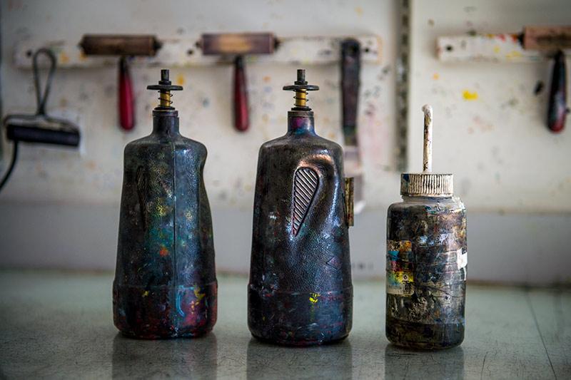 The patina of Well-used dispensers and rinse bottles in the printmaking facility of the Newcomb Art Department become a captivating still life in the right light. 