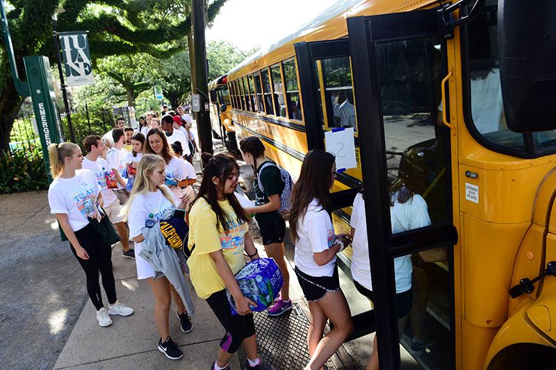 Students load into buses along Freret Street to be taken to the various locations. Students participate in the 28th annual Outreach Tulane.