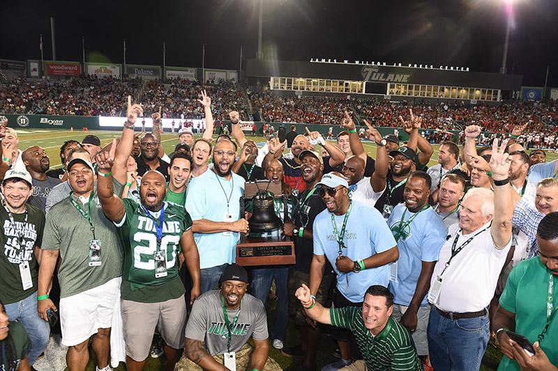 Green Wave football fans celebrate past and present victories.