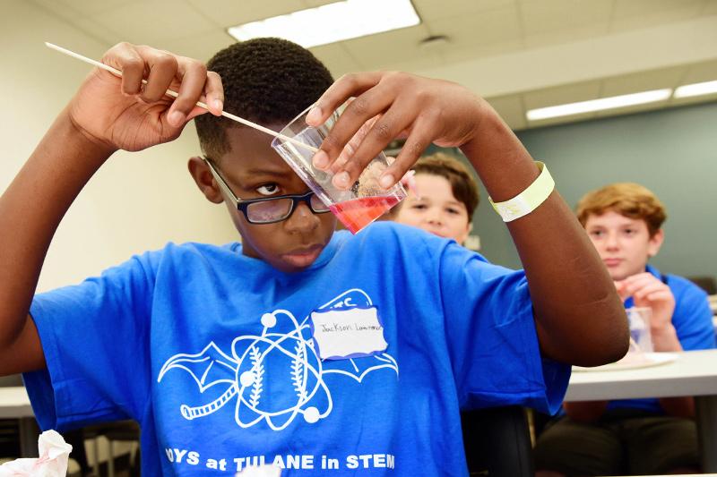Jackson Lawrence from Baton Rouge extracts DNA from a strawberry. Curiosity + fun = knowledge during the fall 2018 Boys At Tulane in STEM event.