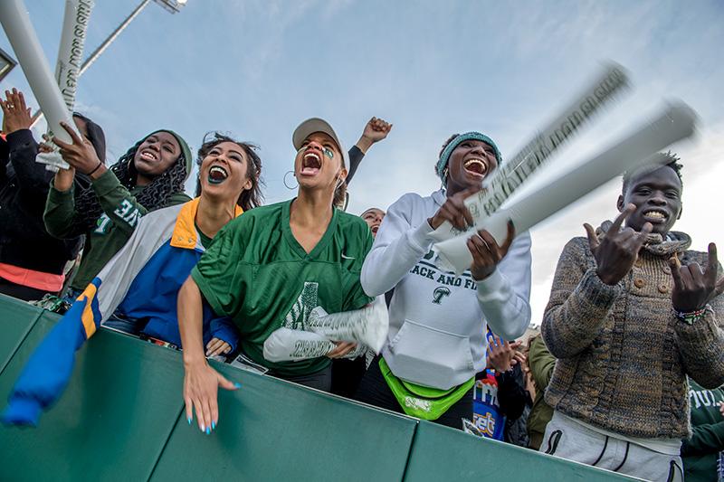 Fans show their love for the Olive and Blue after the first Green Wave touchdown. Homecoming brings together families, alumni