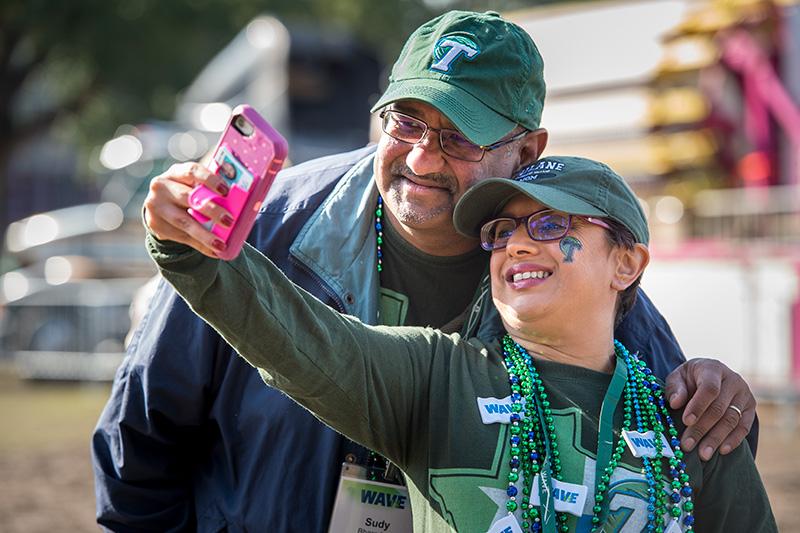 Tulane parents Sudy and Medha Bharadwaj, left to right, pause to take a selfie during the tailgating festivities. Homecoming brings together families, alumni
