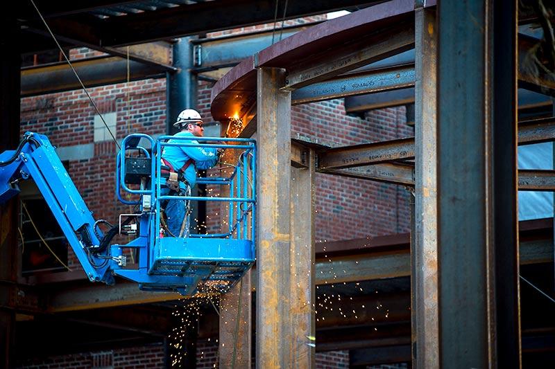 Sparks fly as the A.B. Freeman School of Business expansion rolls along. 