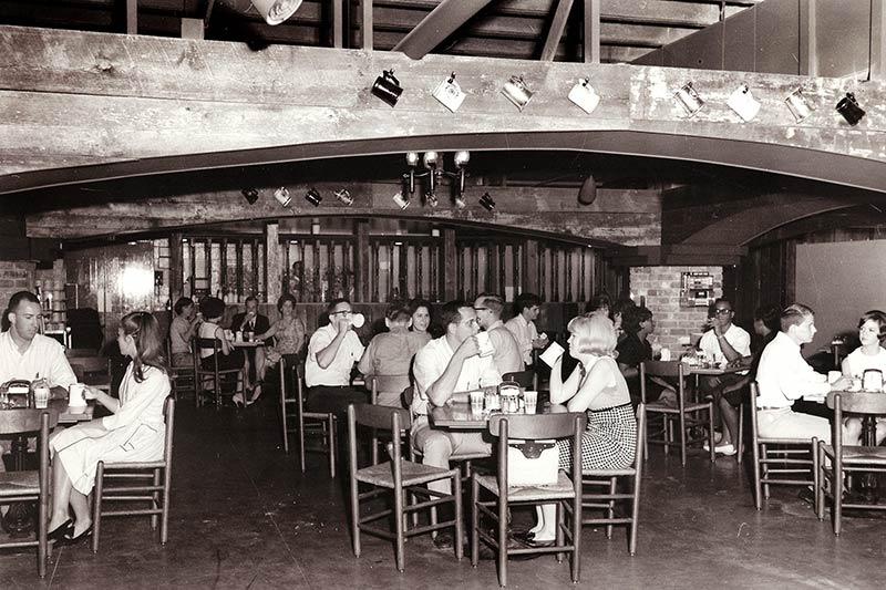 Patrons enjoy drinks at Der Rathskeller in the University Center basement shortly after its completion in March of 1966.