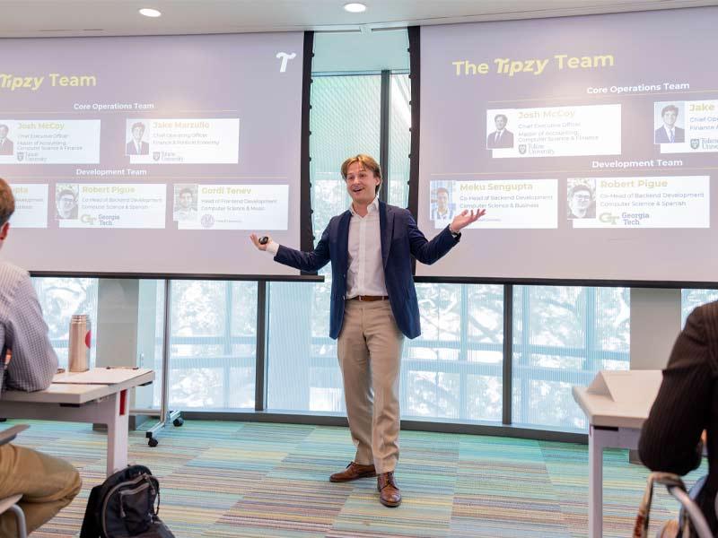 Student Josh McCoy presents a business venture during Pitch Friday, a competition hosted by the A. B. Freeman School of Business that provides students the opportunity to pitch their startups, receive feedback and win a cash prize. McCoy went on to win the round.