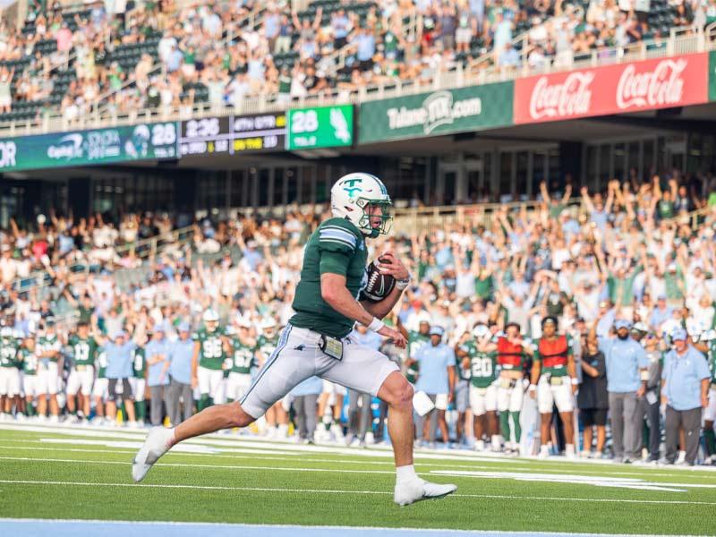 Quarterback Michael Pratt runs into the end zone for a touchdown in the fourth quarter of the game, bringing the Green Wave to victory against the University of North Texas.