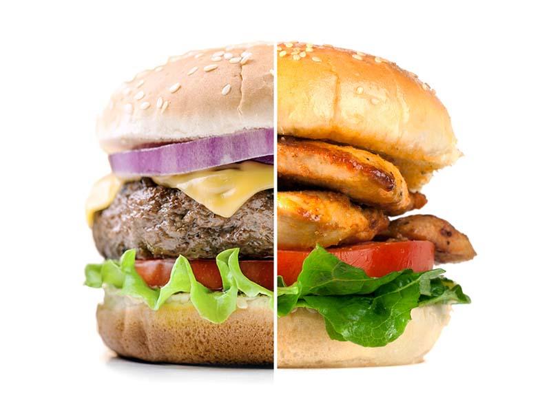 Half a burger next to half a chicken sandwich 