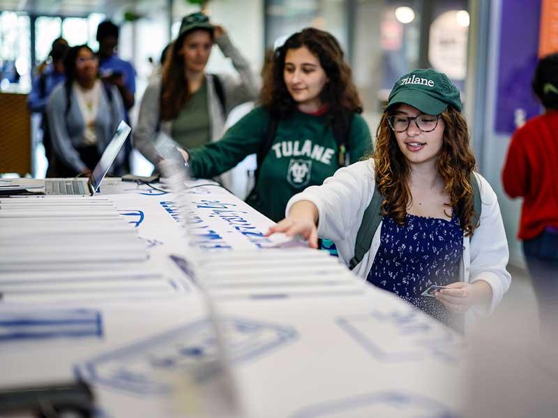 Free 2023 planners are given away at a Tulane Tuesday event. 