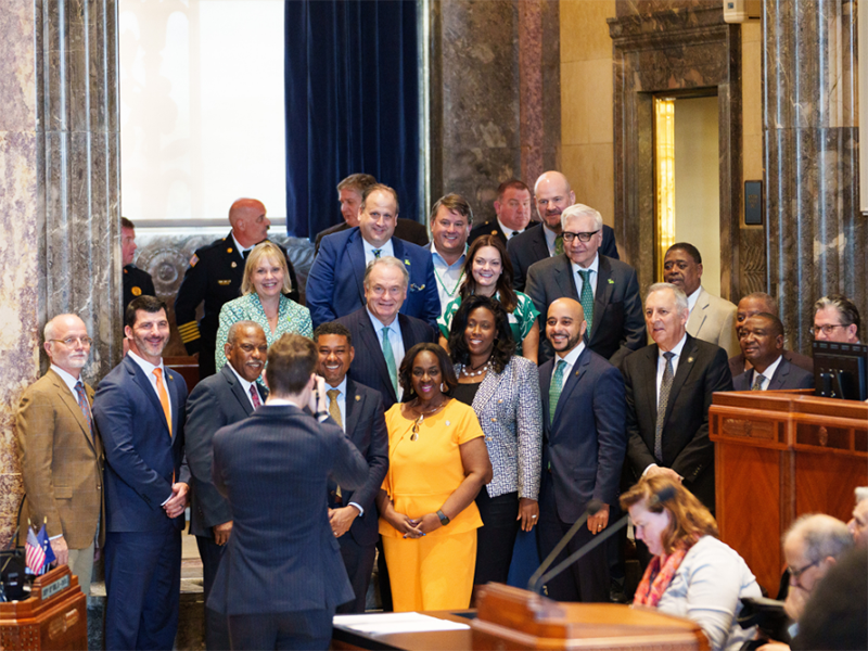 President Fitts with State Senate members and university leaders