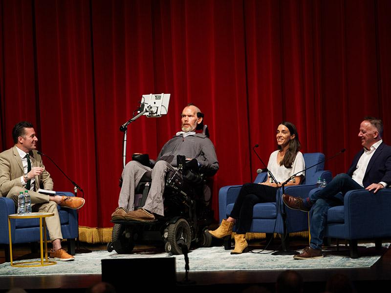 Former New Orleans Saints safety Steve Gleason shares his ALS journey before a packed Dixon Hall crowd at the New Orleans Book Festival at Tulane. Gleason is the co-author of A Life Impossible: Living with ALS,” with Times-Picayune sports columnist Jeff Duncan, right. Also pictured are Gleason’s wife, Michel Varisco Gleason, and WDSU sports anchor Fletcher Mackel, left, who moderated the conversation. New Orleans Saints owner Gayle Benson, honorary co-chair of the book festival, introduced the panel.