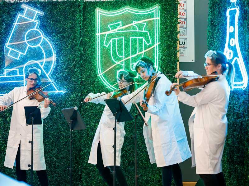 The Virtuosa String Quartet in lab coats playing Thomas Dolby’s “She Blinded Me with Science.” 