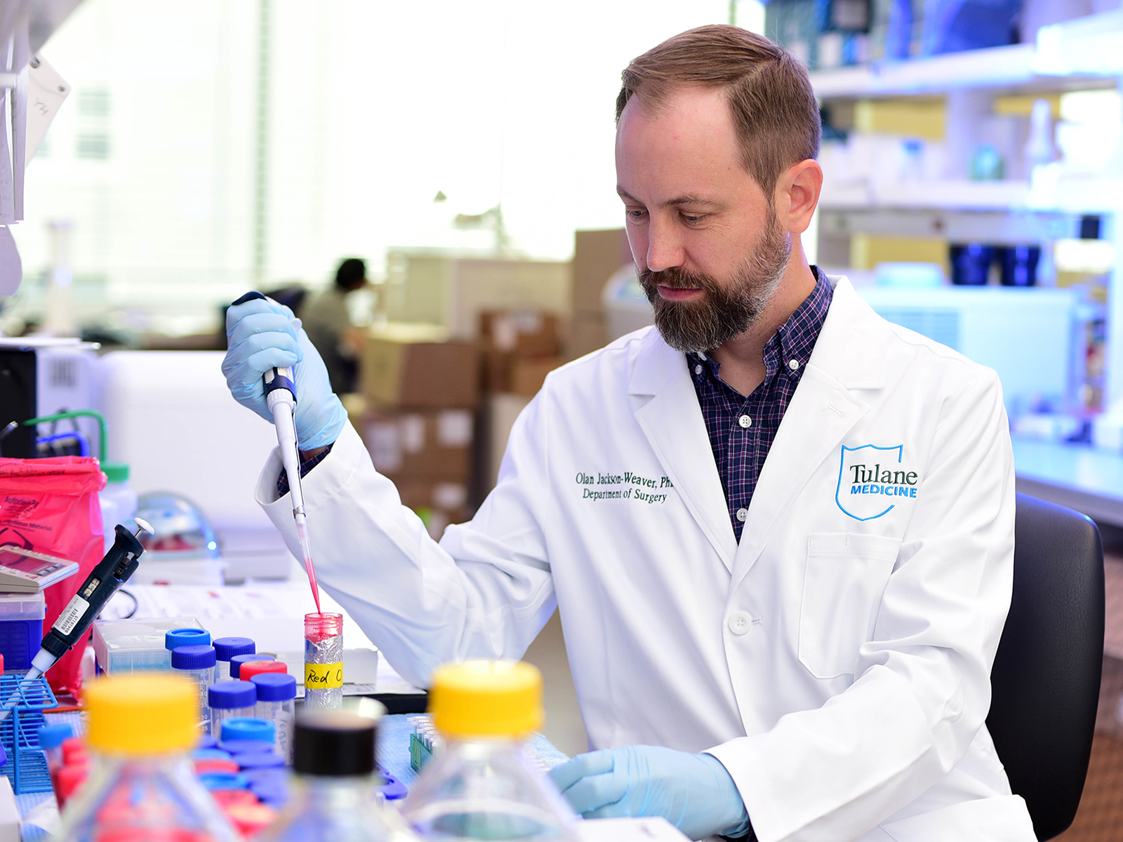 Olan Jackson-Weaver working in a lab