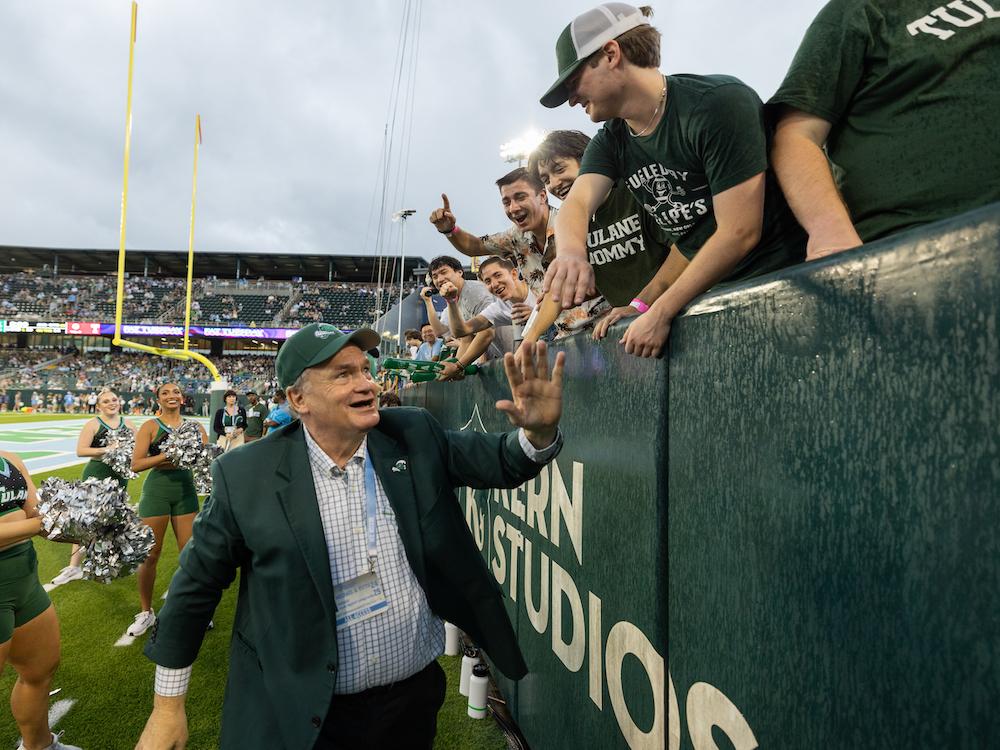 President Fitts high-fives fans at 2024 Homecoming 