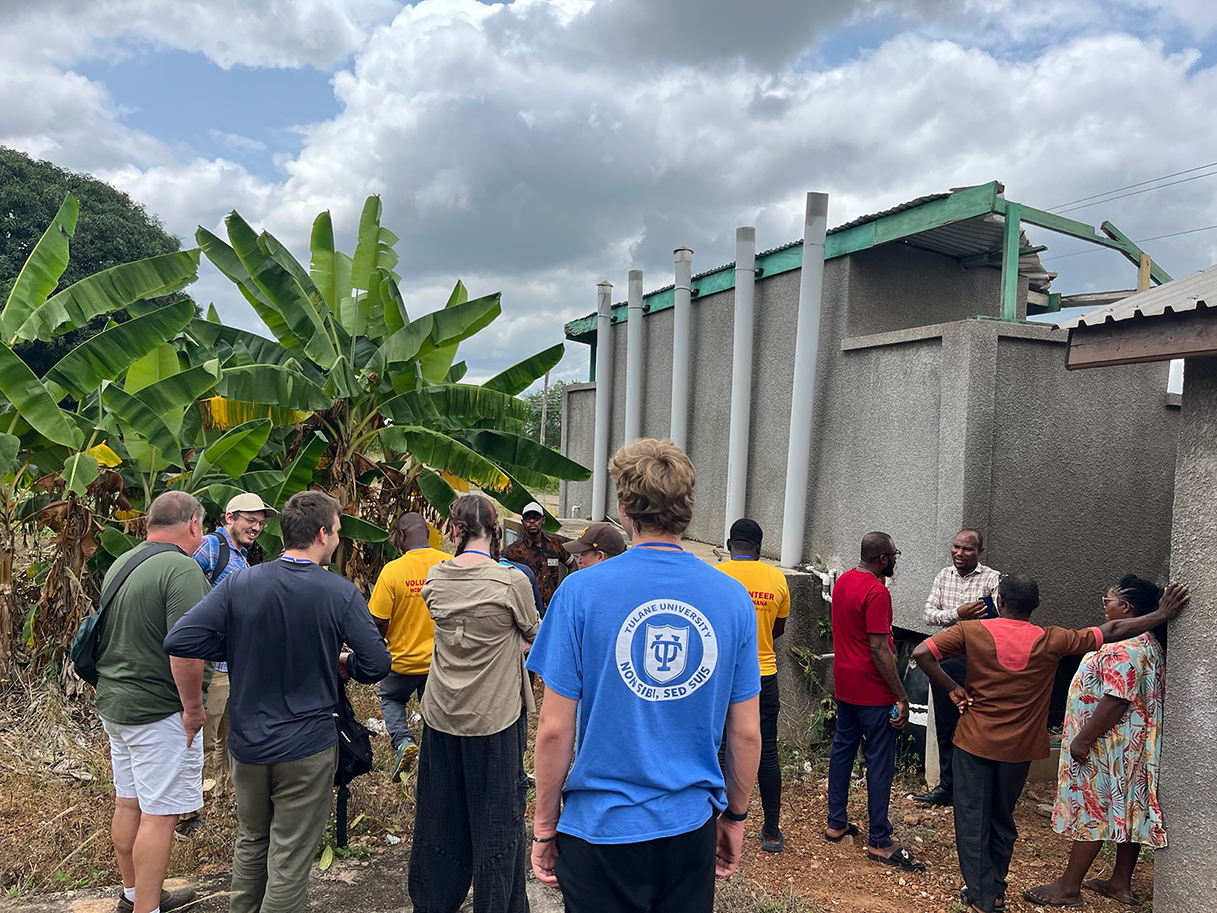 Tulane Engineers Without Borders and HCDP Ghana members assessing composting toilets in Ho, Ghana