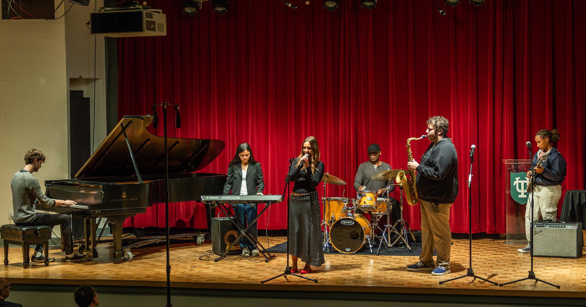 Julian Garcia performs with music students