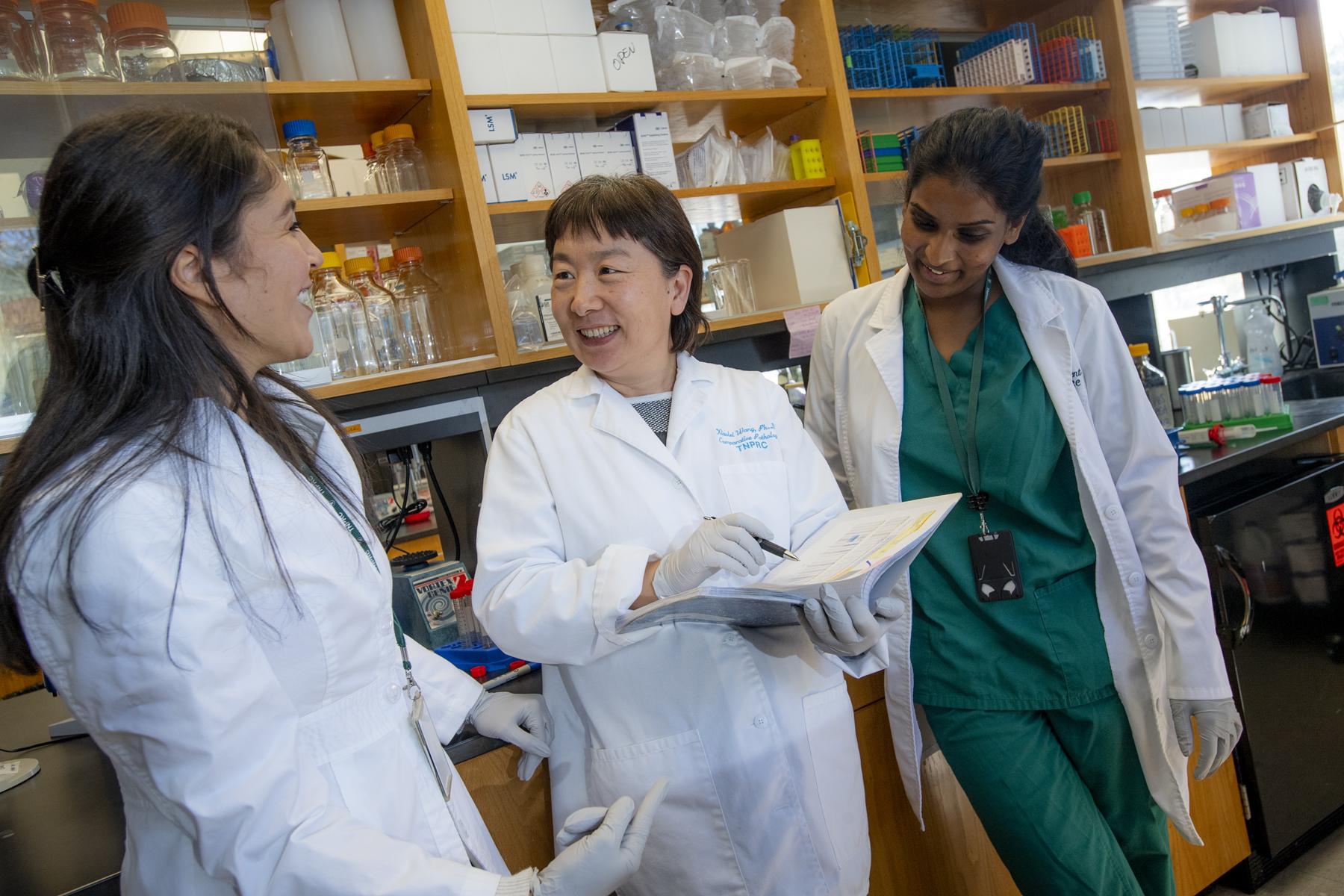 TNPRC researchers from left to right: Widade Zn, Xiaolei Wang, Eunice Vincent