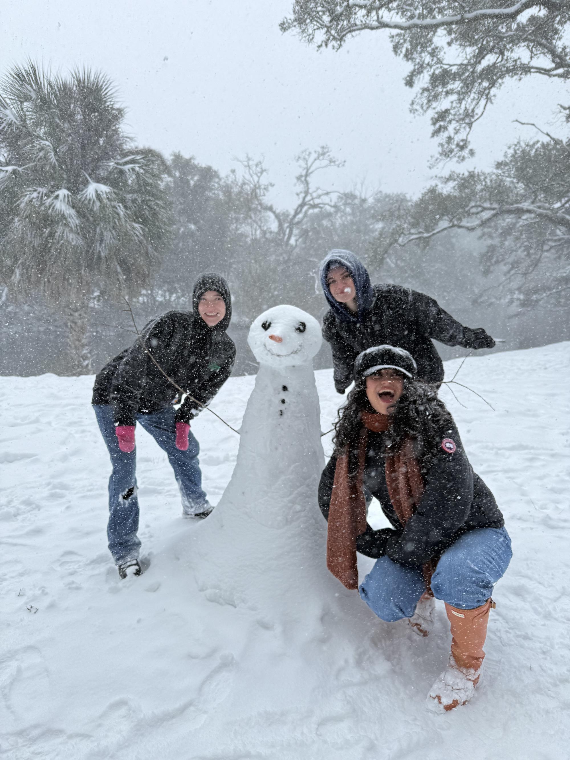 Students build a snowman