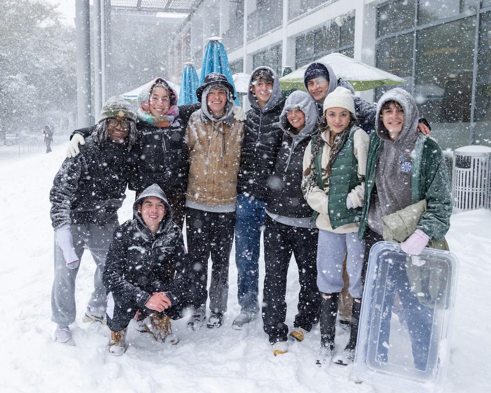 Group of students posing in snow 