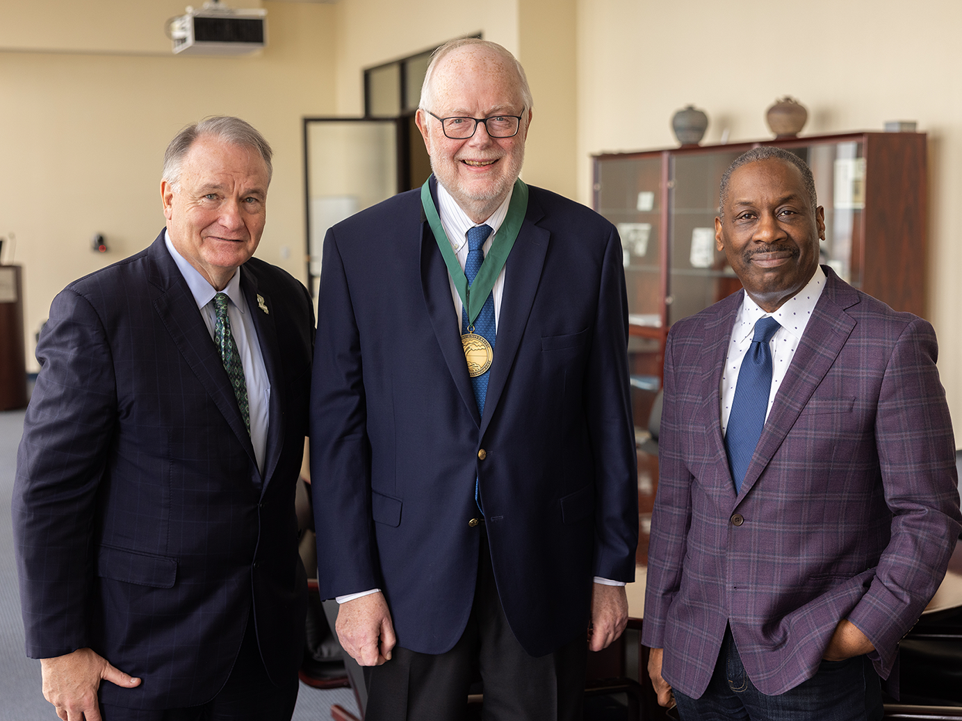 (From left to right) President Michael A. Fitts, Dr. Pierre Buekens and Dean Thomas LaVeist of the Celia Scott Weatherhead School of Public Health and Tropical Medicine 