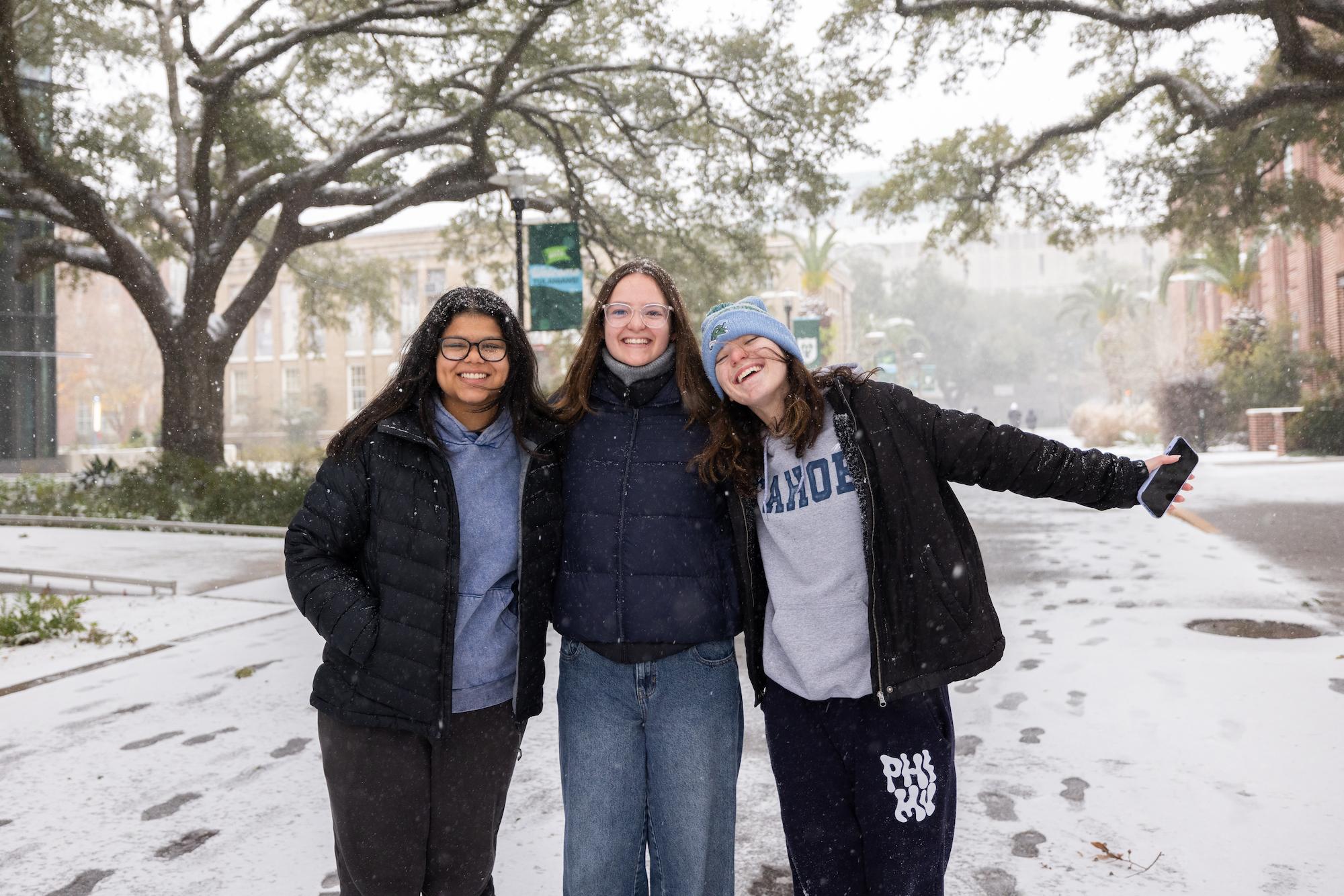 Students smile in the snow 