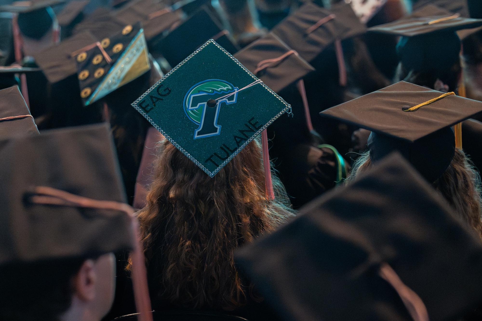 Graduation caps on students. Graduation caps on students.