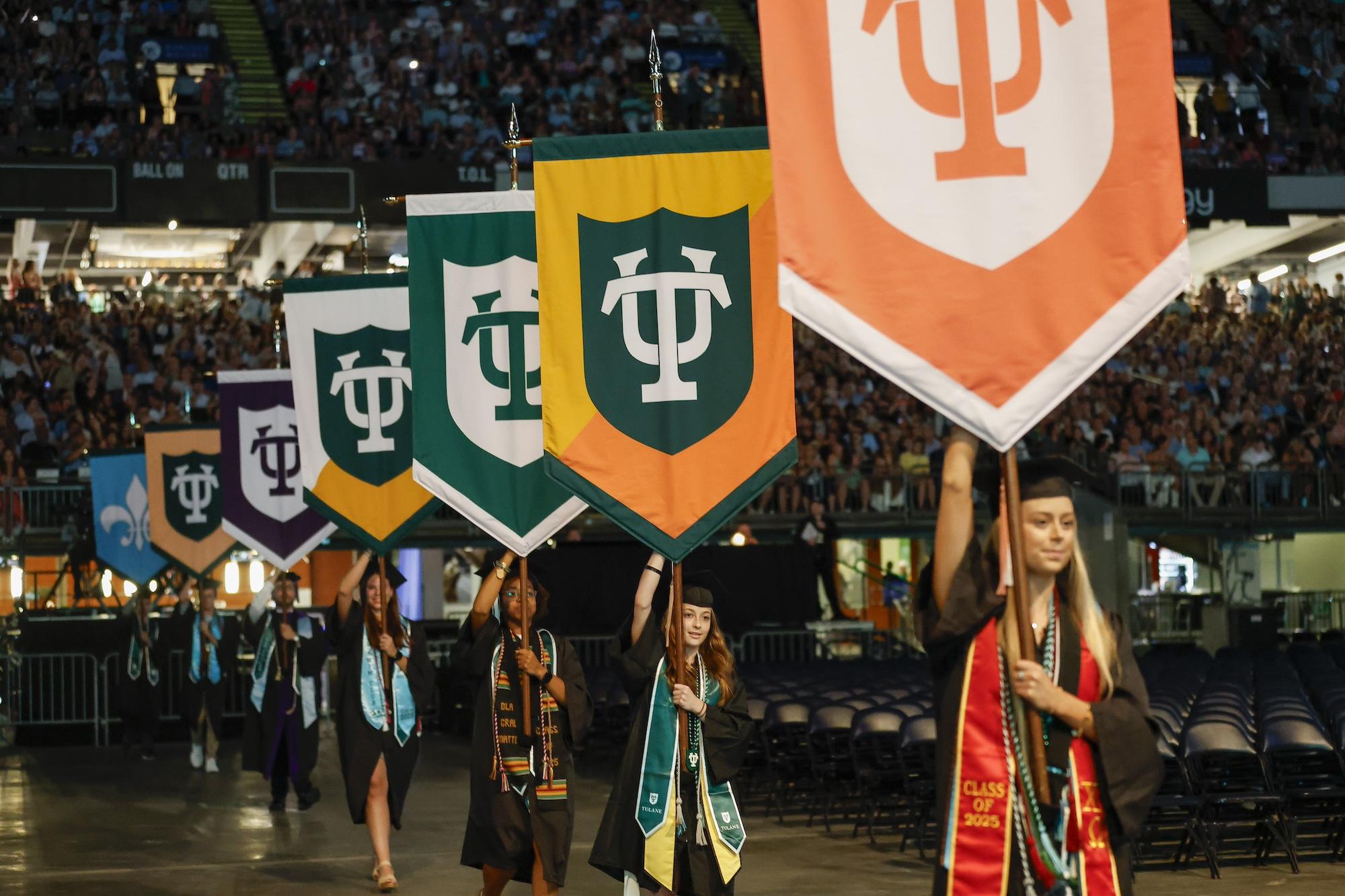 grads carrying gonfalons grads carrying gonfalons