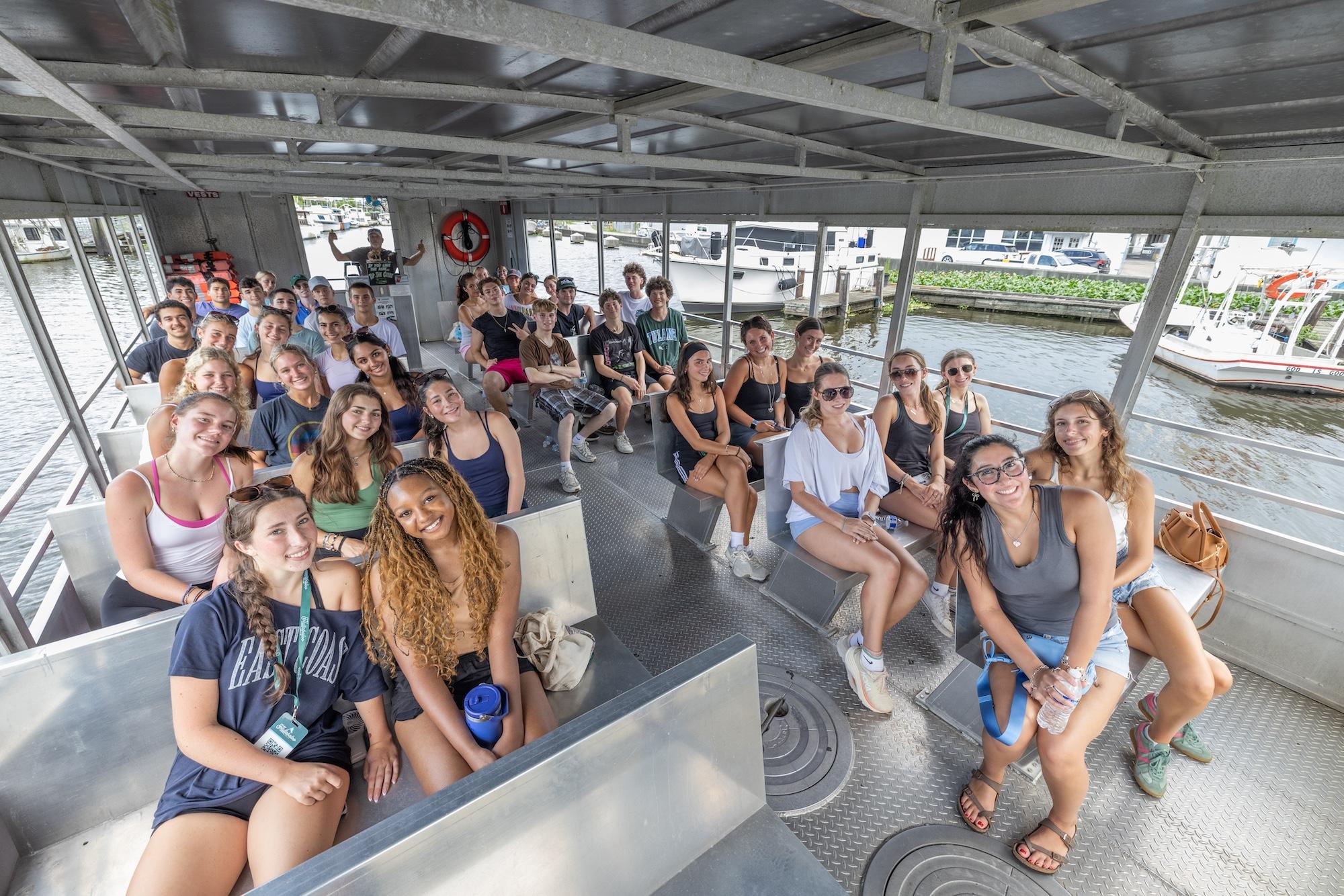 Students smile on a swamp excursion during Hullabaloo Hello