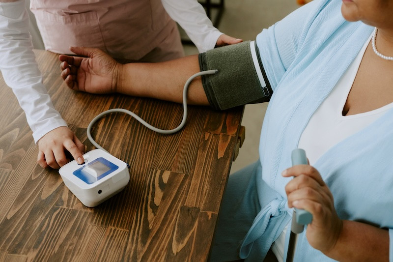 A woman's blood pressure is checked 