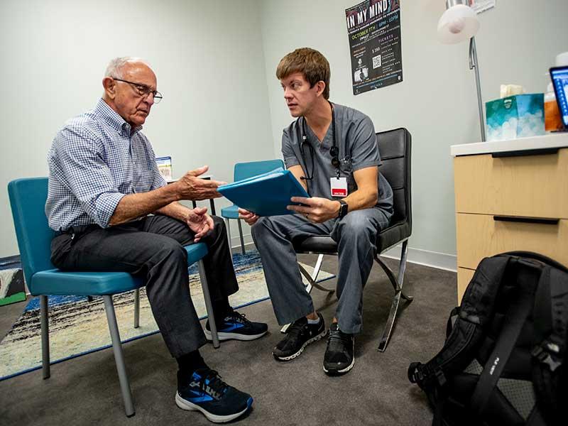 Stephen Milhollin, MD, right, an addiction fellow in the Tulane Addiction Medicine program within the dept of psychiatry confers with Dr. Ken Roy, medical director of addiction medicine at the Tulane School of Medicine. 