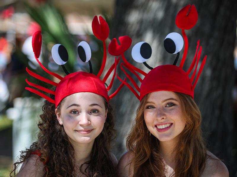 First year students Maeve McAndrews and Chloe Callan don crawfish hats for the big day.